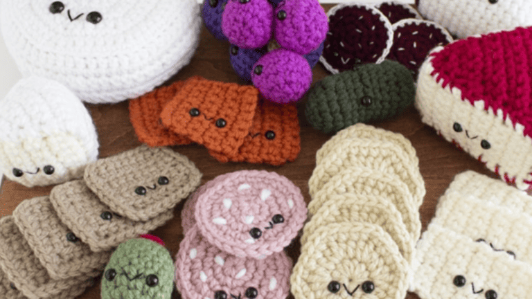 charcterie board with crochet pieces