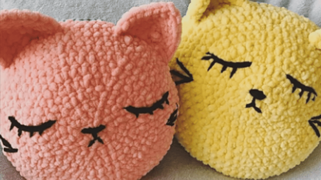 peach and yellow cat pillows that are great crochet toys