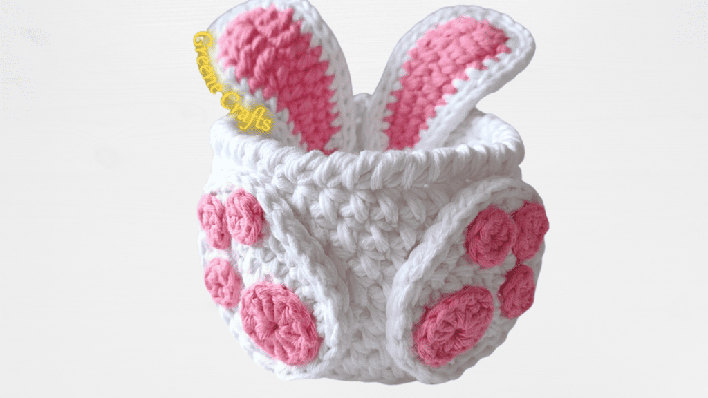 white crochet easter basket with pink feet and ears