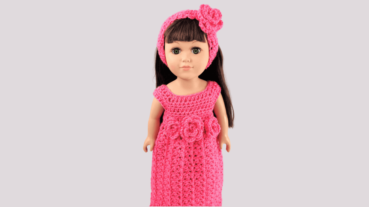 crochet maxi dress patterns for dolls. dress is pink with matching headband