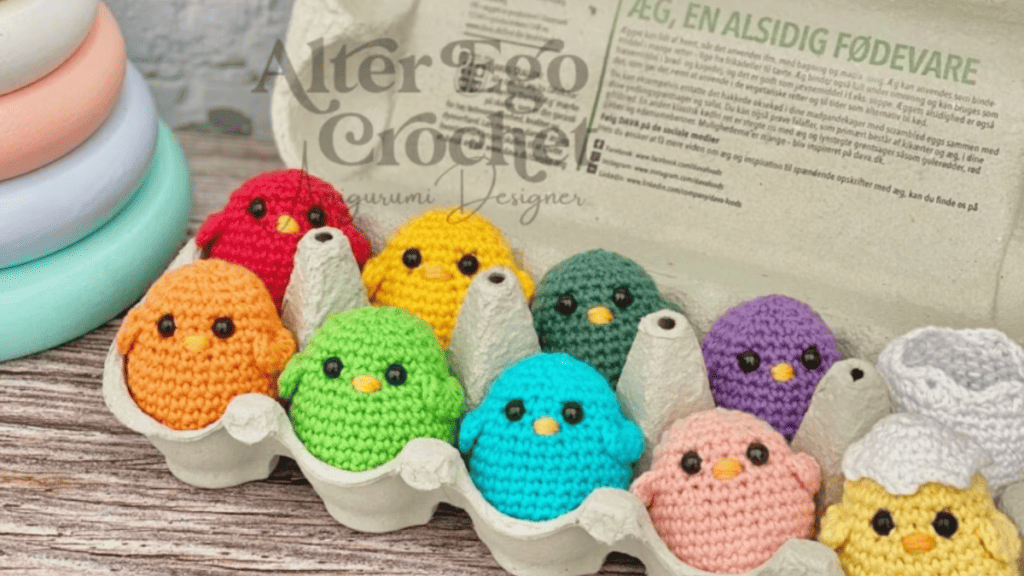 colorful crochet easter chicks in an egg carton