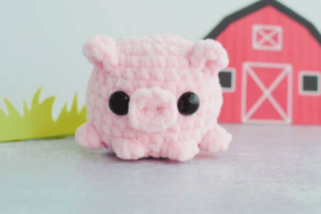 pink pig with black eyes