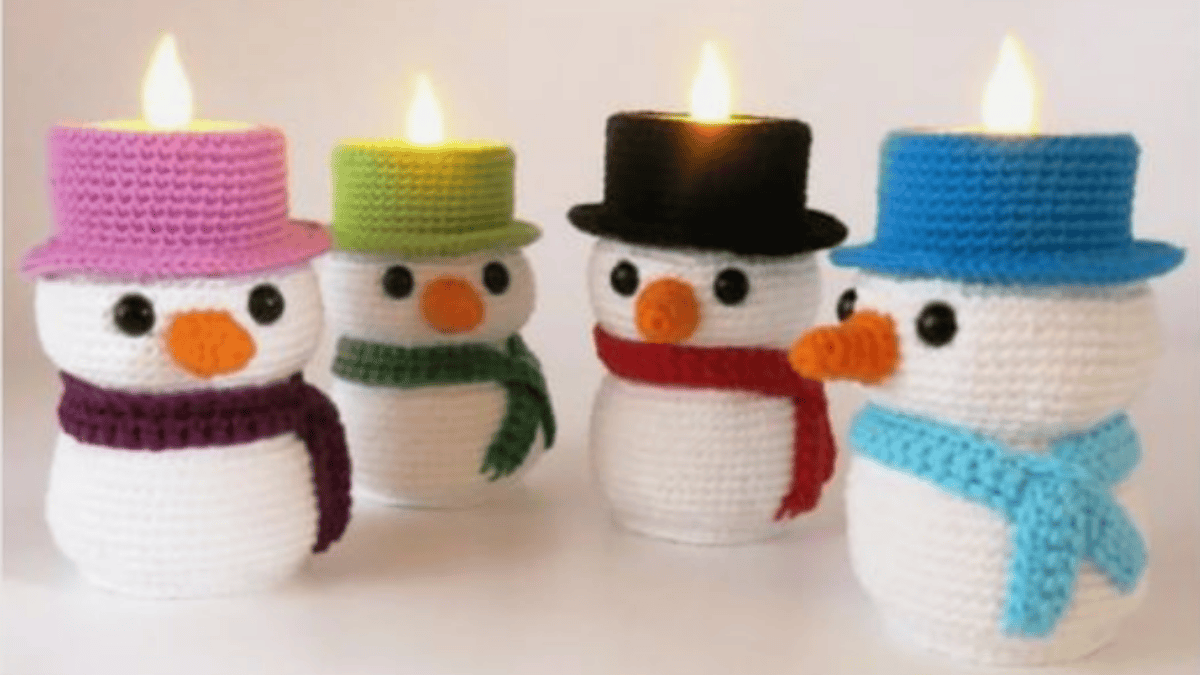 4 snowmen that hold tea light candles