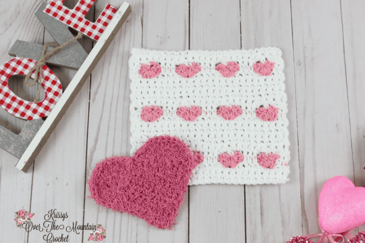 white square dishcloth with pink hearts